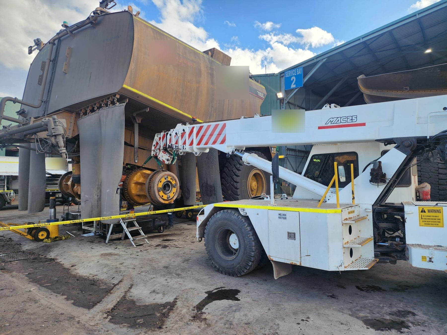 Crane lifting a final drive during a Bowen Basin shutdown