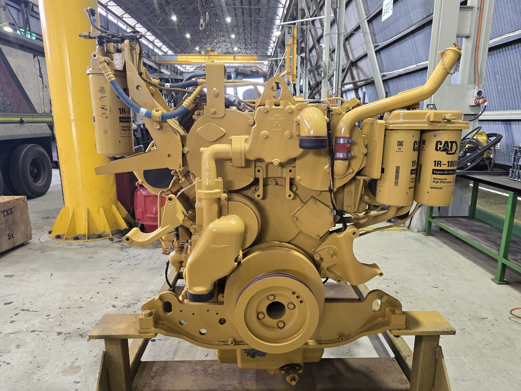 Front view of a rebuilt CAT C27 engine with new filters fitted